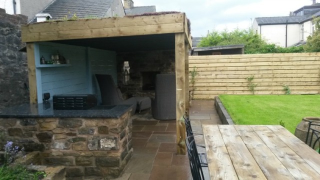 covered outdoor fireplace and kitchen,greenroof